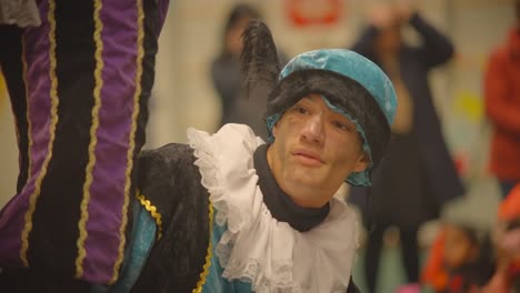 Close-up-of-soot-smudge-Pete-dressed-with-colourful-cap-and-collar-slowmotion