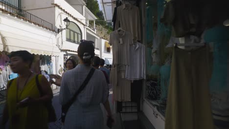 Amalfi-Positano-Italy-Immersive-Travel-Tourism-Mediterranean-Sea-Coast-Water-Europe,-Walking,-4K-|-Moving-Near-Asian-Traveling-Tour-Groups-Exploring-Roads-Below-Famous-Mountainside-Cliffs,-Shaky