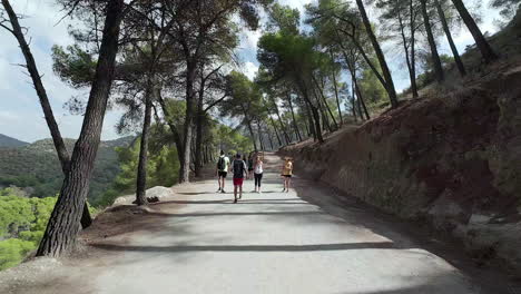 Group-Of-Hikers-Over-Tracks-Heading-Observatorio-Ornitologico-el-Cabrito,-Tarifa,-Cádiz,-Spain