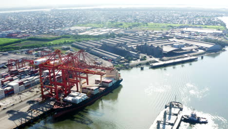 panoramic-shot-with-drone,-ship-in-port,-customs