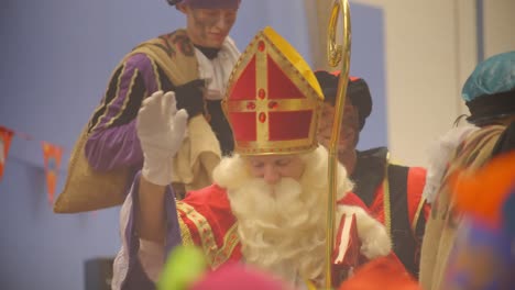 Saint-Nicholas-waving-to-audience-of-children-celebration-close-up