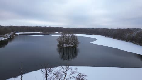 Winter-Snow-ice-lake-wood-forest-cloudy-sky-Germany
