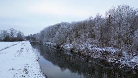 Winter-Snow-river-wood-forest-cloudy-sky-Germany