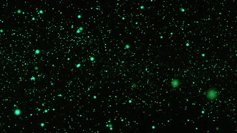 Funkelnde-Grüne-Partikel,-Die-Sich-Im-Dunklen-Hintergrund-Bewegen
