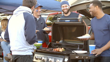 Slow-Motion-Shot-Of-Sports-Fans-Tailgating-In-Parking-Lot