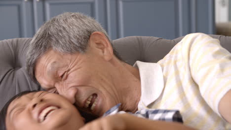 Slow-Motion-Shot-Of-Grandfather-And-Grandson-Laughing