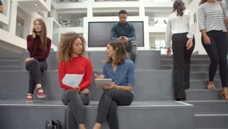 Interior-Of-Busy-University-Campus-Building-With-Students