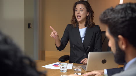 Female-boss-chairing-a-business-meeting-in-a-boardroom