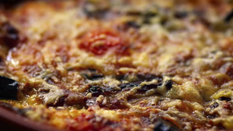 Aubergine-bake,-close-up-of-topping,-rack-focus