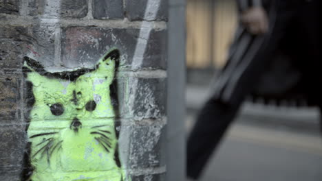 Close-Up-Of-Graffiti-On-Brick-Wall-In-East-London