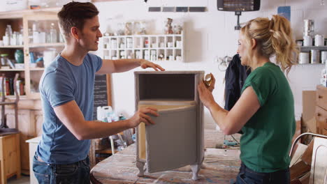 Couple-In-Workshop-Upcycling-And-Working-On-Cabinet-Together