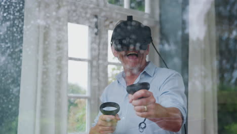 View-Through-Window-As-Mature-Man-Wears-Virtual-Reality-Headset-And-Holds-Gaming-Controllers