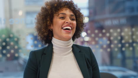 Laughing-African-American-Businesswoman-Sitting-At-Table-In-Office-Meeting-Room