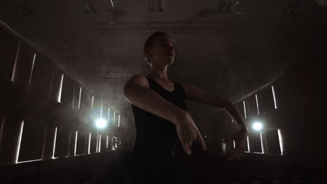 Silhouette-of-young-ballet-dancer-standing-back-to-camera.-Light-silhouette-of-elegant-young-ballerina-standing-back-to-camera-in-second-position-arms-pose-on