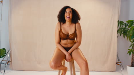 Studio-Portrait-Shot-Of-Smiling-Confident-Natural-Woman-In-Underwear-Promoting-Body-Positivity