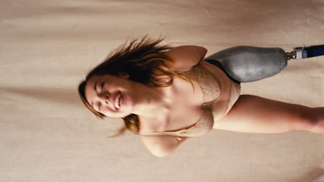 Vertical-Video-Of-Confident-Woman-With-Prosthetic-Leg-In-Underwear-Promoting-Body-Positivity