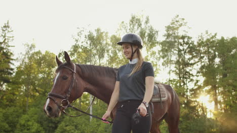 It's-enjoyable-day-with-favorite-horse.-Horsewomen-is-walking-with-her-horse-in-the-horse-club.-Sunny-day-with-warm-emotions-and-good-feelings.