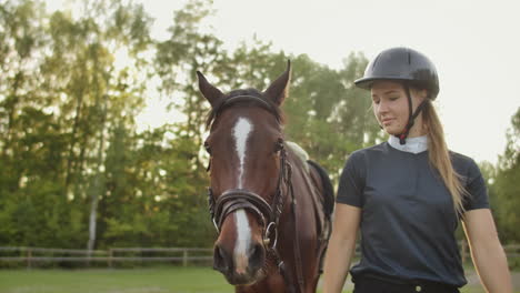 It's-enjoyable-day-with-lovely-horse.-Horsewomen-is-walking-with-her-brown-horse.-These-are-amazing-emotions-and-tender-feelings.