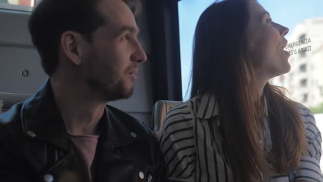 A-happy-couple-in-a-bus-enjoying-their-trip