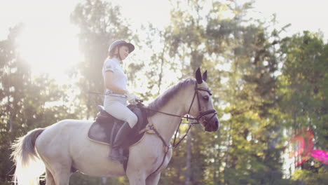 It's-a-sunny-walk-in-nature.-Women-is-riding-on-her-horse.