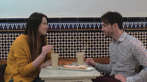 Couple-trying-horchata-in-cafe-of-Valencia