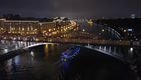 Flying-over-a-night-city-bridge