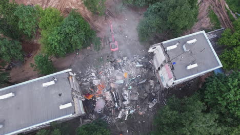 Aerial-shot-of-pulling-down-the-building-by-means-of-machinery