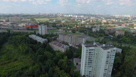 An-aerial-view-of-a-sunny-urbanscape-among-green-trees