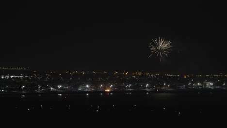 A-night-urban-view-with-bright-firework-over-it