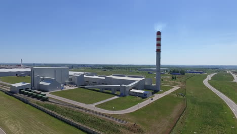 Aerial-shot-of-factory-with-chimney