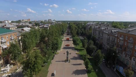 Aerial-scene-of-Russian-town-with-walkway-apartment-blocks-and-green-spaces