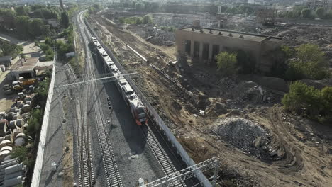 Train-in-city-outskirts-aerial