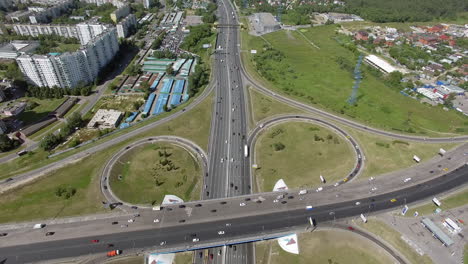 An-aerial-view-of-a-huge-road-junction-and-an-industrial-urbanscape-around-it