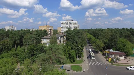 Aerial-view-of-town-surrounded-with-green-wood-Russia