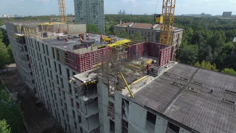 A-roof-under-construction-with-workers-on-it