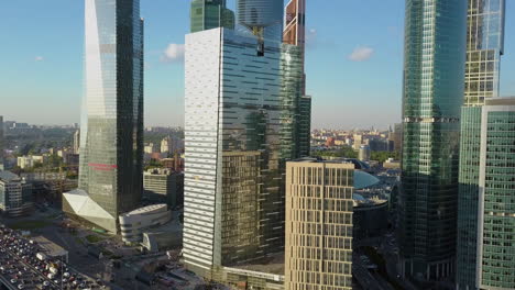 A-vertical-inspection-of-beautiful-skyscrapers-near-the-busy-highway