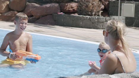 A-woman-with-two-kids-in-a-pool