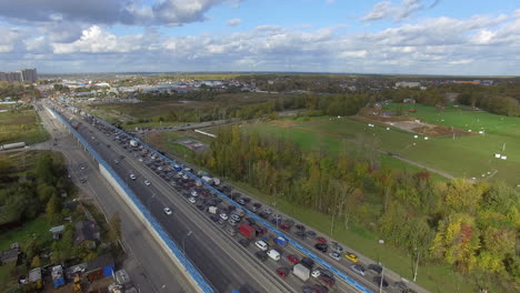 A-busy-highway-with-a-traffic-jam-along-with-the-green-scenery