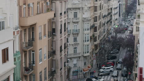 Street-of-Valencia-with-residential-buildings-and-many-parked-cars-Spain