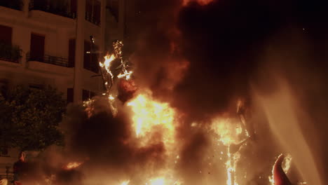 Las-Fallas-bonfire-under-control-of-firefighters