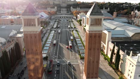 Aerial-view-of-Venetian-Towers-and-road-traffic-in-sunny-Barcelona-Spain