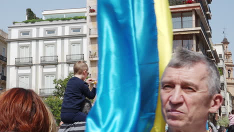 Parents-with-children-at-a-protest-rally