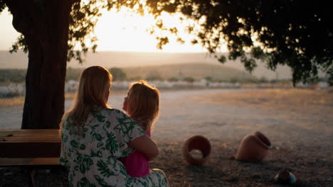 Mother-and-little-child-in-the-country-at-sunset