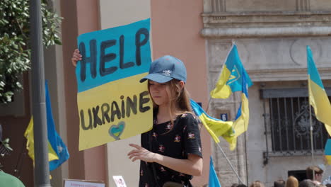 Teenage-girl-with-a-placard-at-a-rally