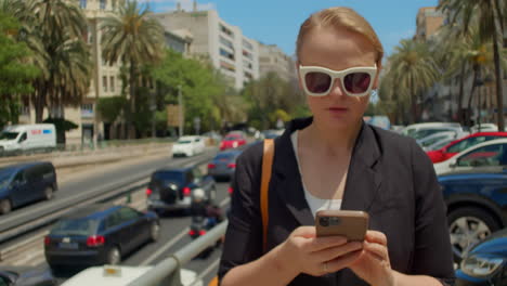 A-young-woman-is-walking-down-the-street