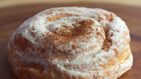 Sweet-bun-in-powdered-sugar-with-cinnamon