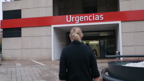 Woman-Entering-Urgencias-with-Protective-Mask