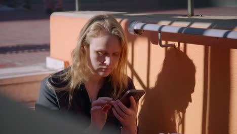 A-woman-with-a-mobile-phone-on-the-street