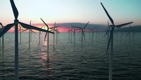 Konzept-Für-Erneuerbare-Energien-Windgeneratoren-Stehen-Im-Meer-Vor-Dem-Hintergrund-Des-Umweltfreundlichen-Sonnenuntergangs