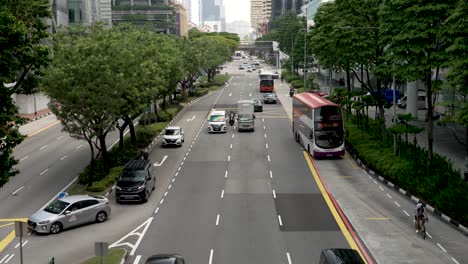 A-slow-motion-overhead-shot-of-vehicles-travelling-along-Eu-Tong-Sen-Street-on-their-daily-commute-in-the-modern-urban-city-of-Singapore